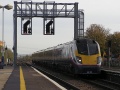 180109 enters Didcot Parkway from the east and passes under the rather photogenic signal gantry.
