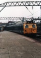 304033 leaves Crewe with the 11.22 to Manchester on 19.11.83.