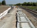 Piles of sleepers had been delivered in readiness for laying.