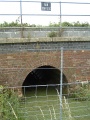 The Rhyne passes under the railway at 129m-76.75chains from London. 15.7.04