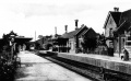 A postcard of Charfield station from the 1800s with all the station staff posed for a photo.