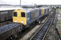 A busy day at Hallen Marsh in summer 1984. 20106 and companion arrive with a down freight, a Class 46 waits on the up main, wagons wait to be dealt with on the Inwards and Outwards sidings (from & to the Smelter) and wagons stand on the 'Column' road. © P.D.Rendall/Past-Track Publications