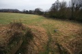 The view east from atop the bridge with the infilled Westfield Lock below.