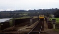 A colour photo of the same scene. Sleepers remain across the bridge following the singling of the line. © Simon Whittingham