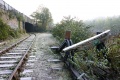 One line now ends at a dilapidated buffer stop while the other continues under the roadbridge. © Andrew Ross