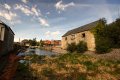 The view from the basin towards the lock. The remains of the approach Road to Stroud Wallgate station, which crossed the canal at this point, can be seen in the background.