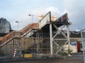 The footbridge had been considerably shortened in order to fit in with the housing estate, and the staircase was a temporary one made from scaffolding.