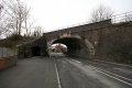 Viewed from the other side. The road narrows at this point and only has one pavement, which is carried under the railway in a separate underpass.
