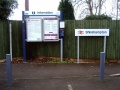 Station name board and information board located in the station carpark.