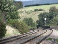 A telephoto shot north with the bridge over Station Road visible next to the signal.