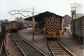 37071 waits to form 7C62 service to Severn Tunnel Junction, meanwhile the pilot 03382 shunts out empty vans that had arrived with bagged cement from Aberthaw, this was manually unloaded in the shed. 6/5/80 © Kevin Redwood