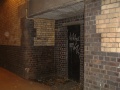 There are a couple of doorways either side of the road that lead into the station.