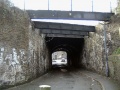 A 2004 Look through the bridge with Silverthorne Lane beyond. The bridge had been reduced in places to just girders across the road.