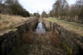 Standing on a concrete dam at the head of the lock and looking in the direction of Stroud.