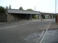 The same view on the 8.8.04. Both the road and the railway have been widened. A canal boat chugs gently under the railway.