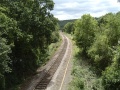 The view into Bristol with the tree-lined Avon Gorge in the distance. This was once the location of Sneyd Park Junction and the line to Hotwells. The bridge visible carries a footpath from the Portway to Old Sneed Park.
