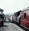The same train leaves Cheddar. The goods shed can be seen in the distance (this is now a house) and the signalbox is on the left. © Gerald Peacock