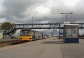 A view of the platform shelter on Platform 2/3. 143612 about to set off with a service for Bristol.