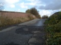 A general view across the dilapidated road surface.