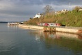 A DMU trundles along the River Teign west of Teignmouth station. © Andrew Ross