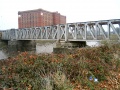 A side-on view of the bridge looking east from the south banks of the River Avon.