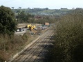 From this bridge we get a good look at what's left of Chipping Sodbury station. There's a platform at the bottom right, and the old goods shed is occupied by track maintenance vehicles.