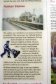 An information board at the side of the cycle path which includes a photo of the original station.