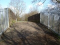Looking across the bridge. This is bridge No. 282 and was built to carry a private road over the railway to Sereant's Farm which lay to the north of the railway. The farm is now a housing estate and the bridge conveys pedestrians from it to Wapley Common.
