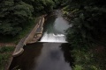The view of a weir and fish leap on the Afon Lwyd beneath the canal.
