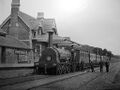 A broad gauge engine and crew at the original Portishead station.