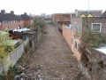 Standing on Kingsland Road and looking towards Barton Road. The remains of the railway leave a lovely scar right through the ramshackle buildings that sprung up each side of it.