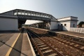 The main station building viewed from platform 1 showing the footbridge.