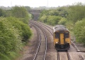 A zoomed view showing 150221 having just passed under Hall End Lane road bridge.