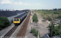 The view towards Hallen Marsh Junction on 25.6.92. A DMU heads for Severn Beach. The area on the right was to become the reception sidings for the Bulk Handling Terminal. © Neil Higson