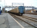 A look at the footbridge with a train of Cargowaggons underneath. The red brick building behind the train is the crew, control and signalling building.
