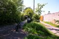 The Norton-Radstock Greenway runs between the industrial premises and Station Road.