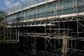The road bridge is also covered in scaffolding.