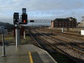 Standing at the west end of the station looking along the line to Cardiff Canton. The line curving to the left in front of the depot is the line for Barry.
