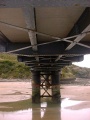Under the bridge.