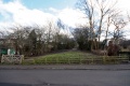 The view east from street level showing the gap left in the railway route when the bridge at this location was removed.