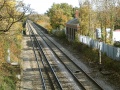Standing on the bridge at Station Road/Harcombe Hill and looking east. This building is all that remains of Winterbourne station. The premises were in use by a car repairer.