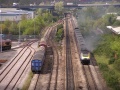 An HST storms past on the mainline. It's interesting that there's what looks like a three-way point at the throat of the yard. The 66 on the right was 66079.