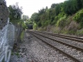 Dangling the camera over a fence and recording the view south from the site of Wickwar Goods Yard with the portal of Wickwar Tunnel visible in the distance.