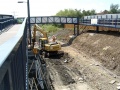 The footbridge extension and new footpath were open and the old footpath was being dug up in readiness for tracklaying to commence.