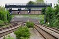 The view south with a new signal gantry blocking the view of Stanley Farm Footbridge.