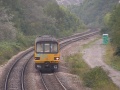 A graffiti damaged 143603 climbs Filton Bank, Bristol on 7.10.05.