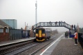 153372 arrives at the station and finds a gathering of people waiting to photograph 6024 King Edward 1 on a Christmas Capitals United Express special service. © Michael C G Owen