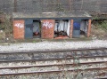 A view of some of the lineside huts and debris at this location.