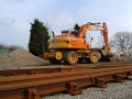 A road/rail digger stored on site February 2004.
