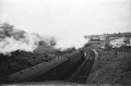 ...and heads off for Bristol. The lineside hut is beside the advance signal for the junction at Mangotsfield, which is where the Signal Road (on the right in the pic) got its name from. Also of interest. Between the lineside hut and the garage-type building is a low area that used to be a siding access into an old quarry that got buried by a Mangotsfield council depot. © Clive Moore